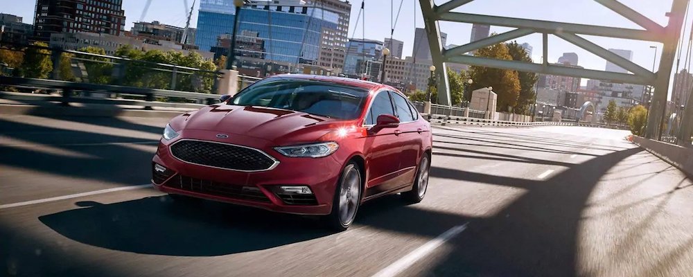 2019 fusion driving across bridge