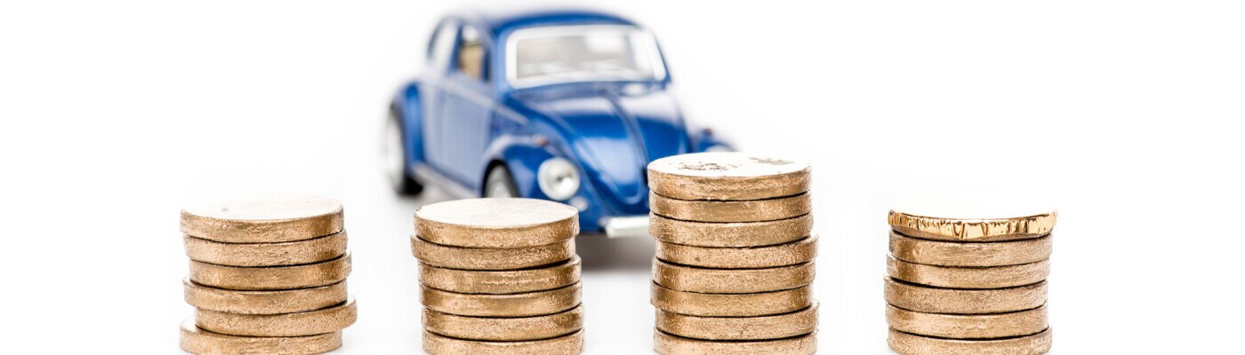 Tiny car behind coins.jpg