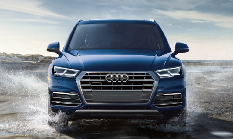 2020 Audi Q5 front view driving through water on a beach