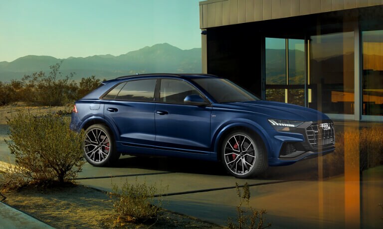 Blue 2020 Audi Q8 parked outside a house