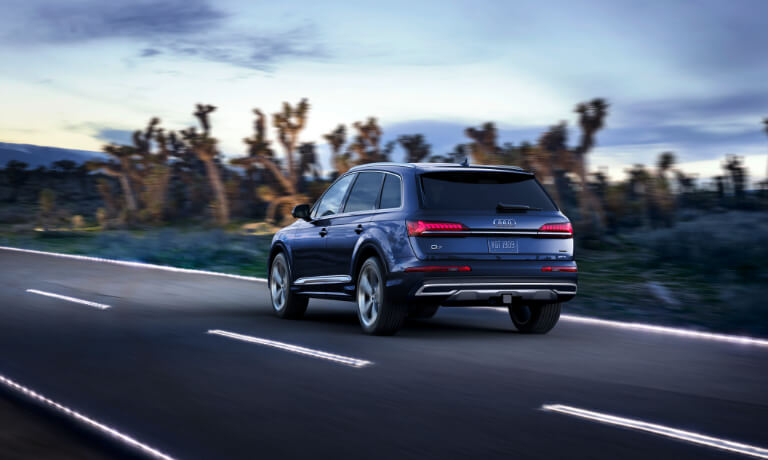 Blue 2020 Audi Q7 Rear View driving on a desert road