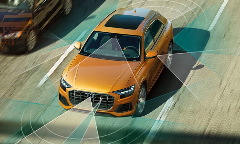2020 Audi Q8 driving on the highway with safety sensors
