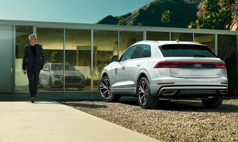 2021 Audi Q8 exterior outside house with man walking to vehicle