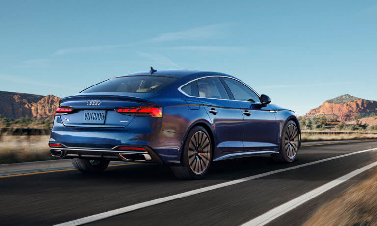 2023 Audi A5 Sportback exterior driving away on desert highway