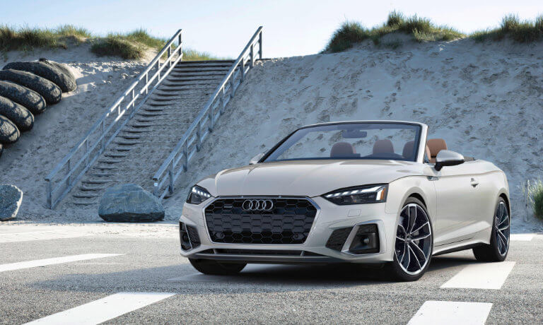 2024 Audi A5 Convertible exterior near beach steps