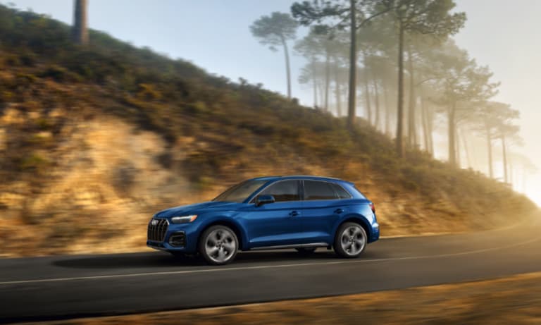 2022 Audi Q5 exterior driving at sunrise