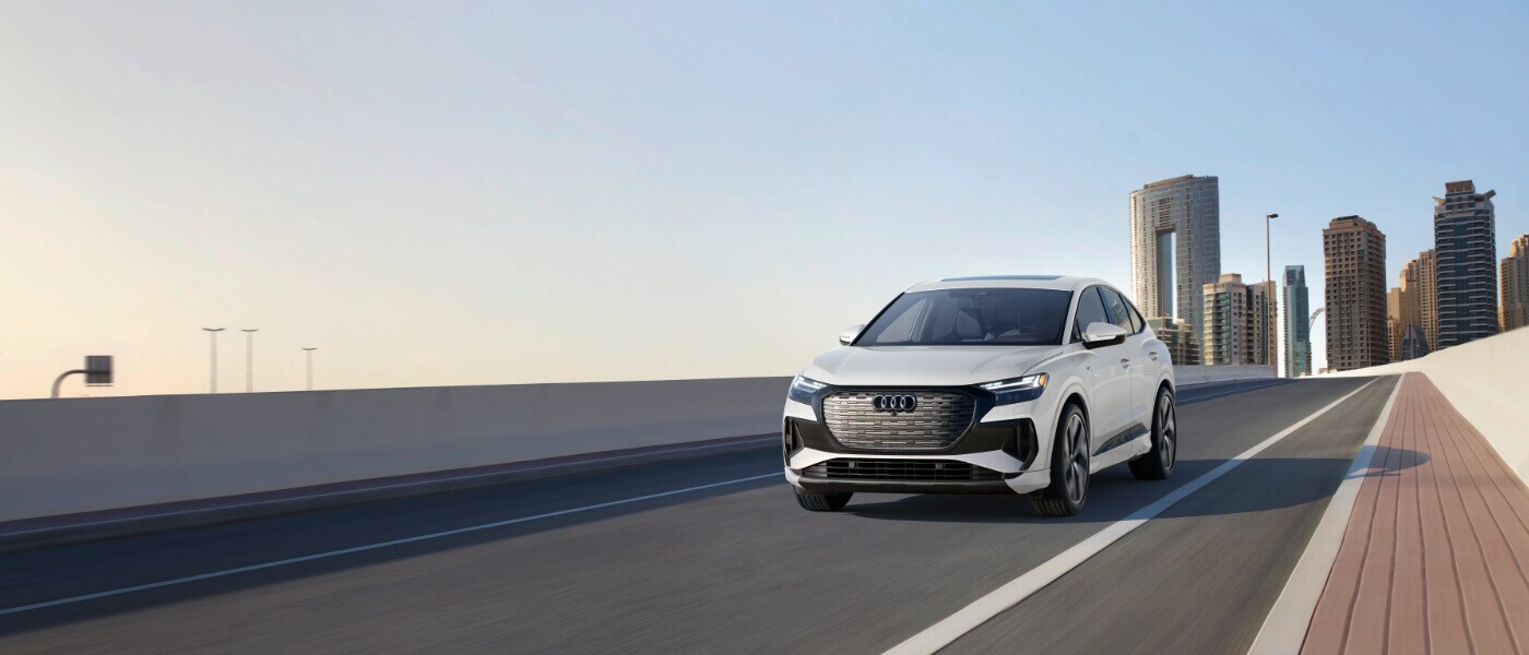 2025 Audi Q4 Sportback e-tron Exterior Driving Away From City