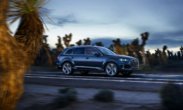 2020 Audi Q7 side view driving on a desert road