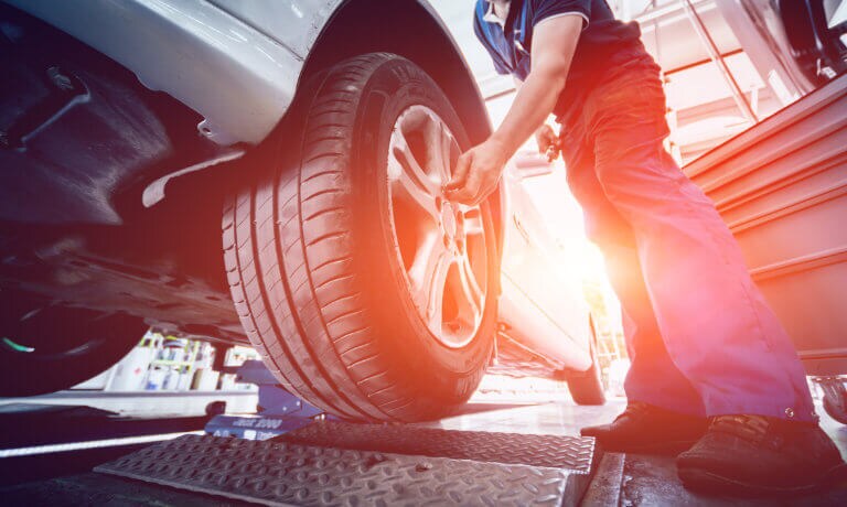 Service tech working on tire