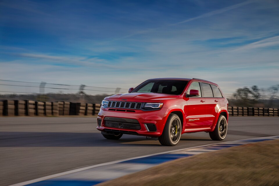 2018 Jeep Grand Cherokee Trackhawk SUV red in motion.jpg