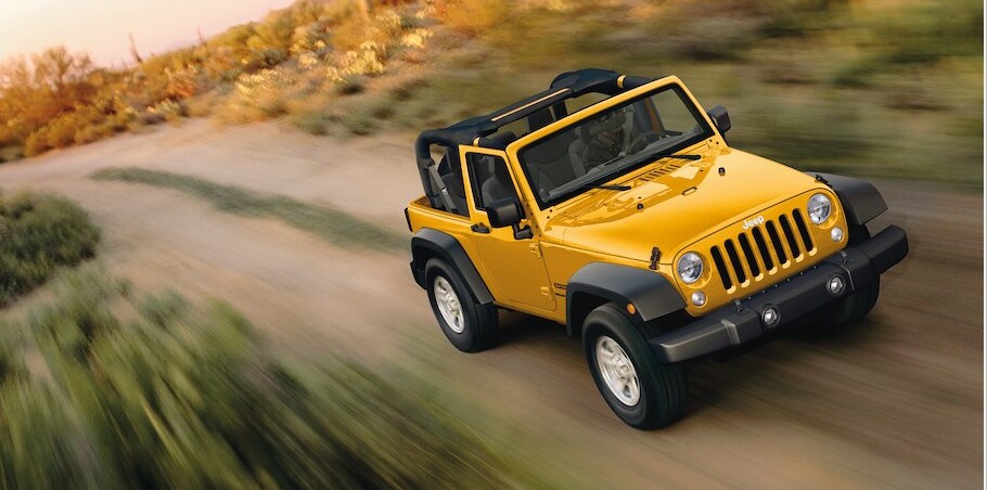 2018 Jeep Wrangler Sport-SUV yellow in motion_2.PNG