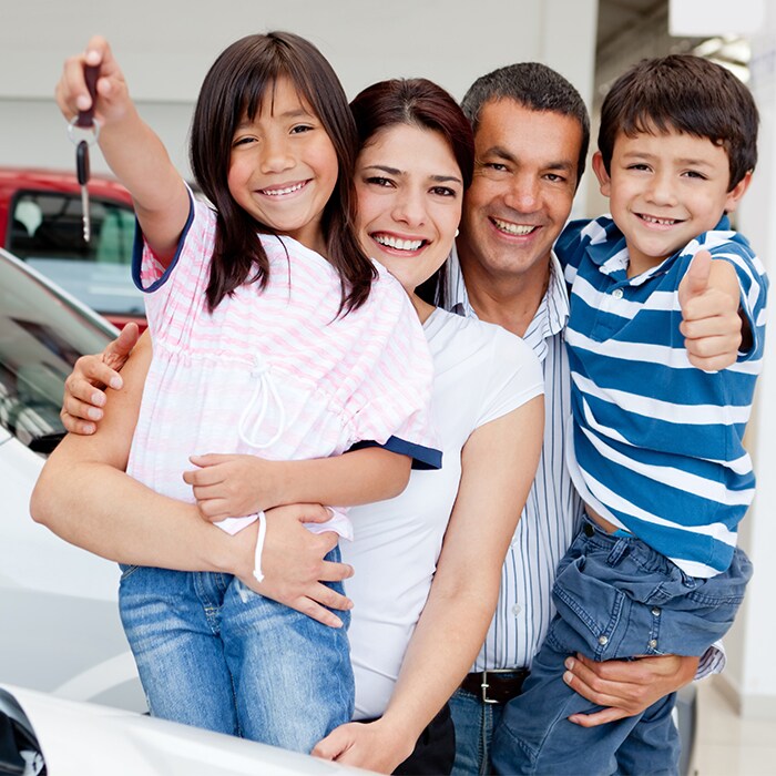 family of four in car dealership.jpg