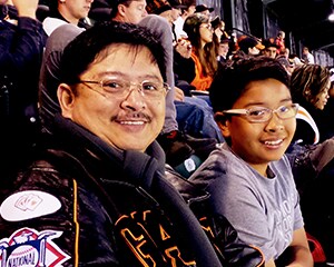 Father and Son watching game