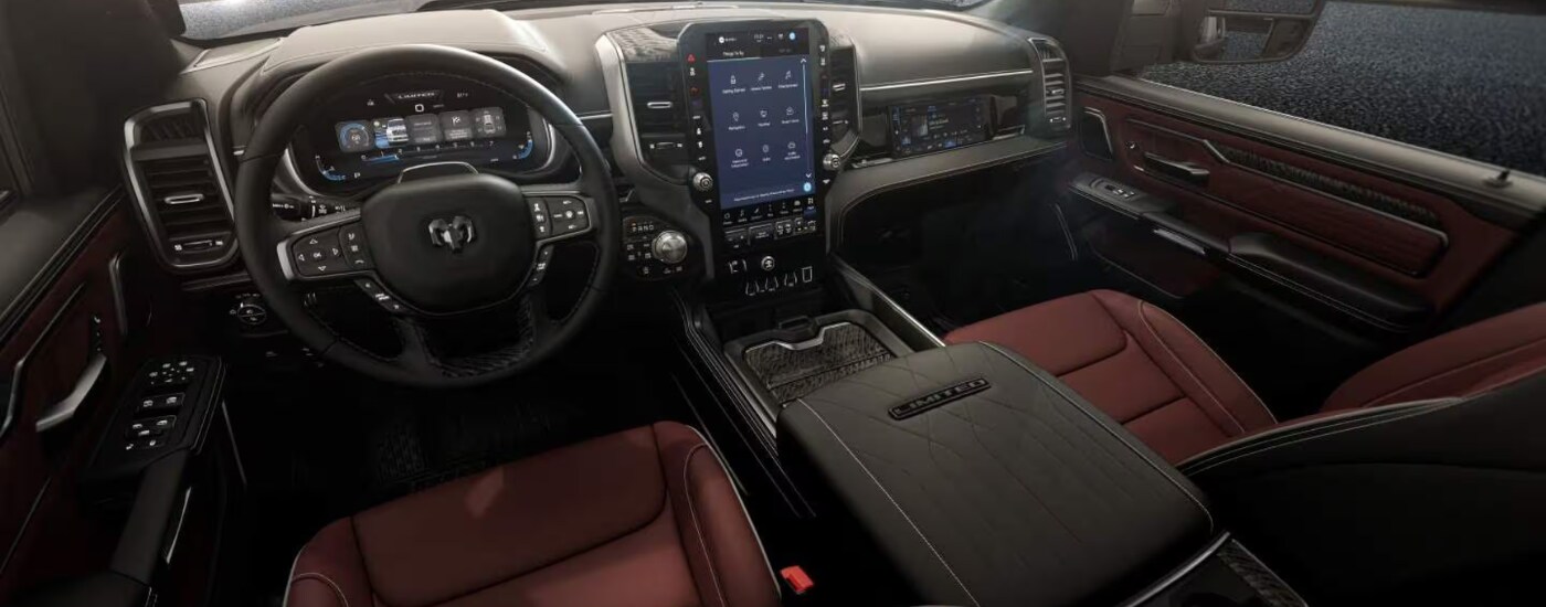 2027%20Ram%201500%20-%20redblack%20cabin.png Black and red interior of a 2027 Ram 1500 limited