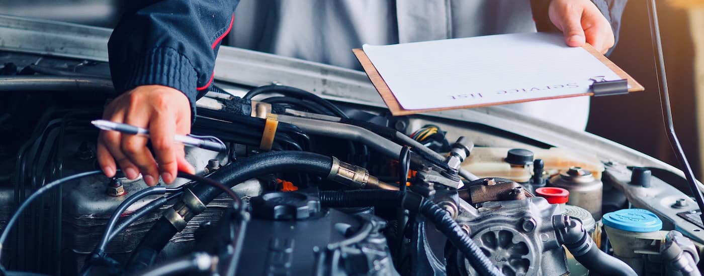 Mechanic performing an inspection on an engine.