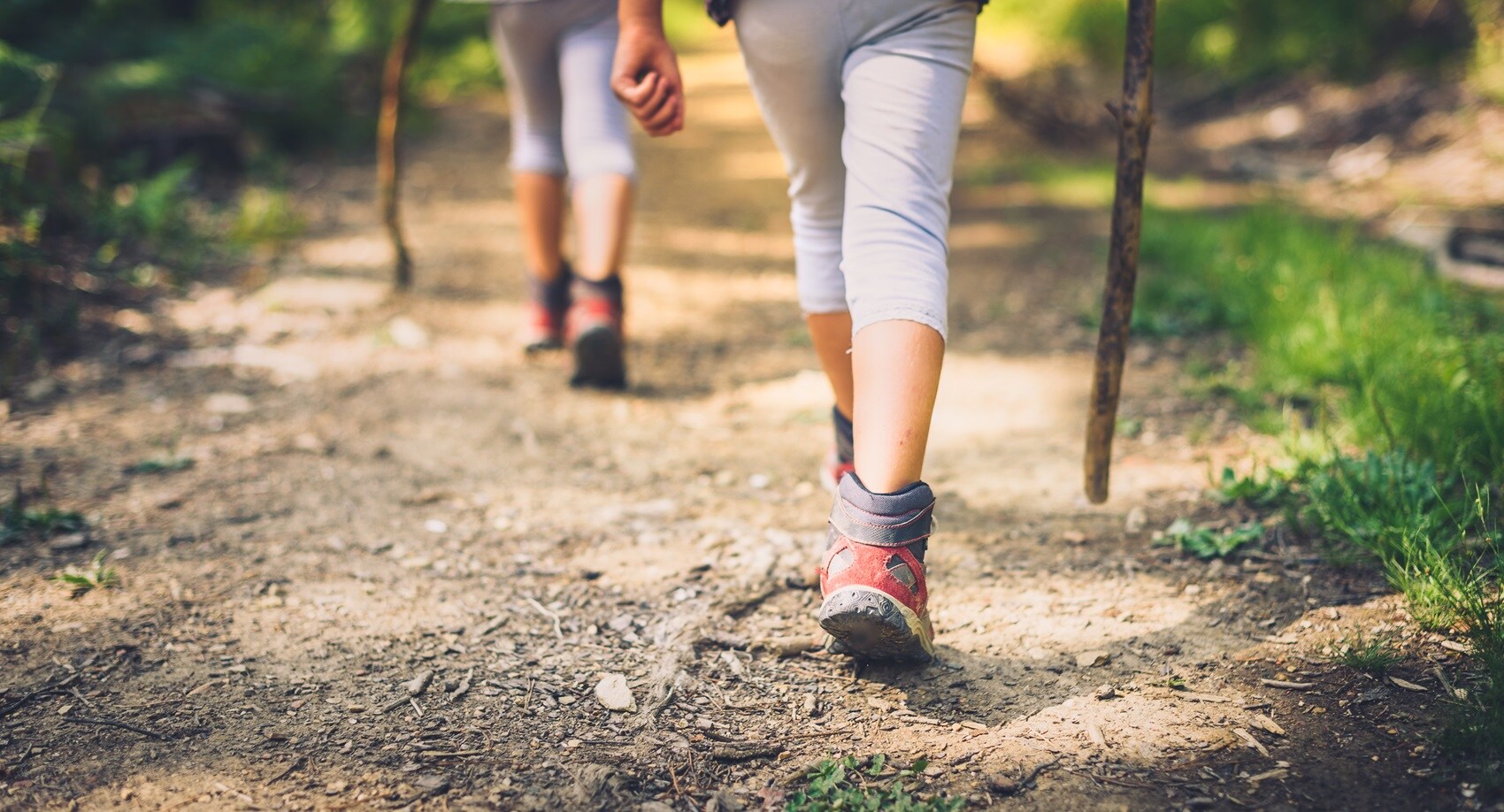 Two people hiking along trail in Plymouth CT