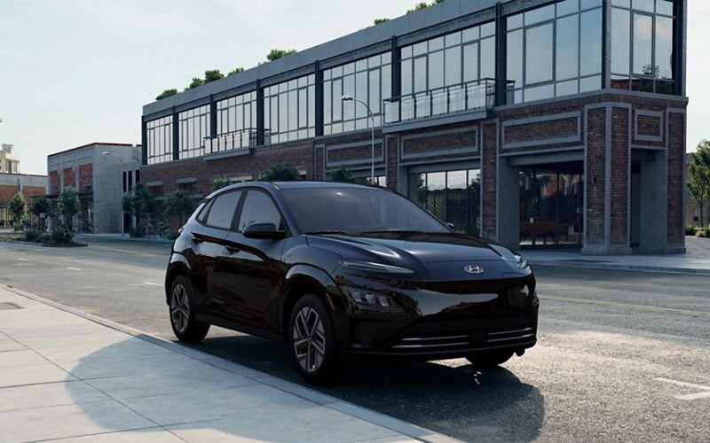 Hyundai Kona Electric SUV parked on downtown street - Electric Vehicles Woodbury CT