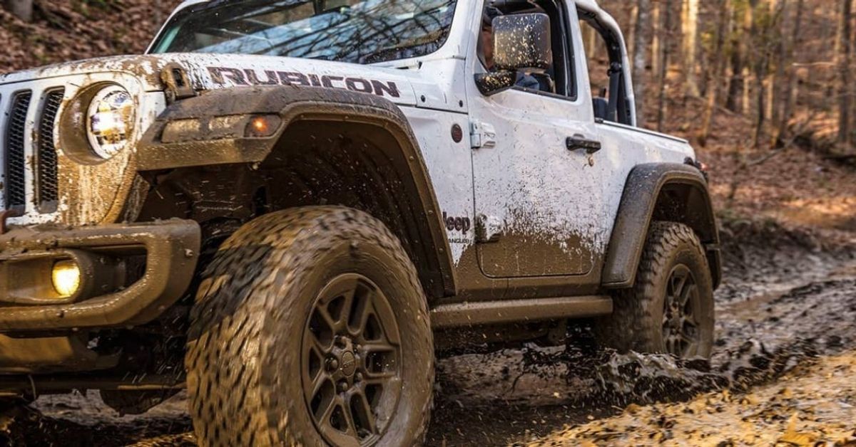 White 2021 Jeep Wrangler Rubicon In The Mud.jpg