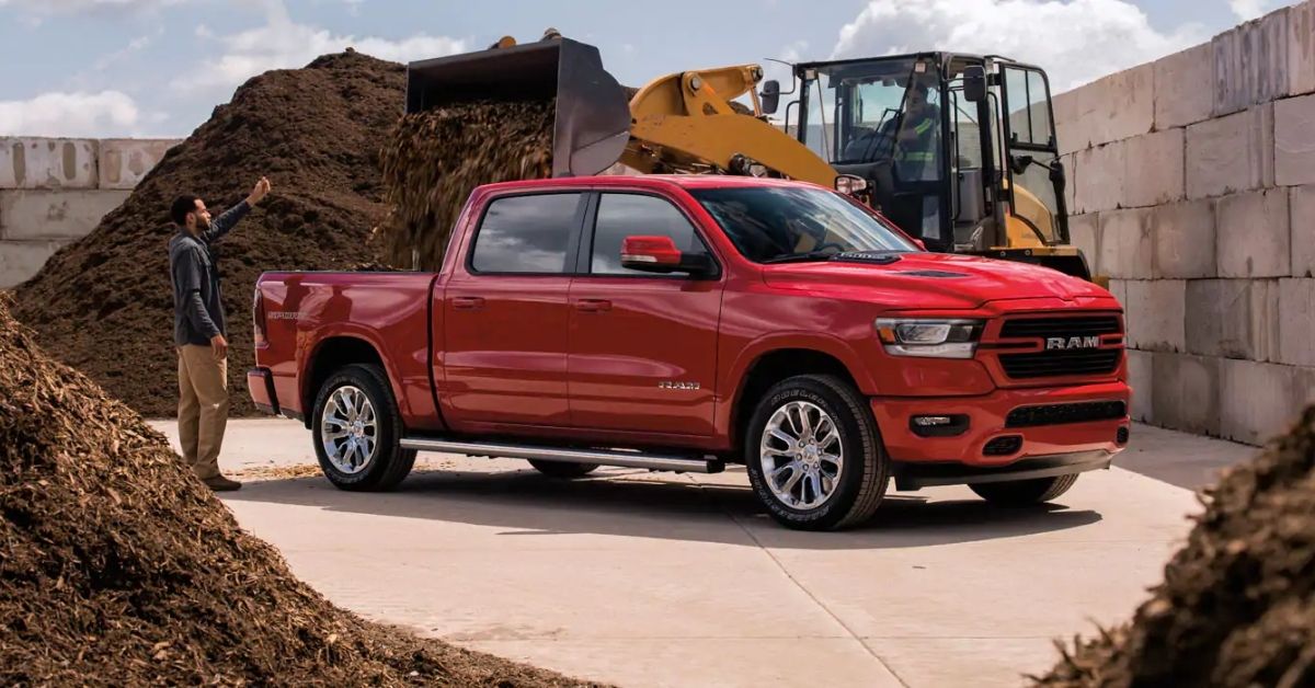 Red 2021 RAM 1500 Getting Loaded With Dirt.jpg