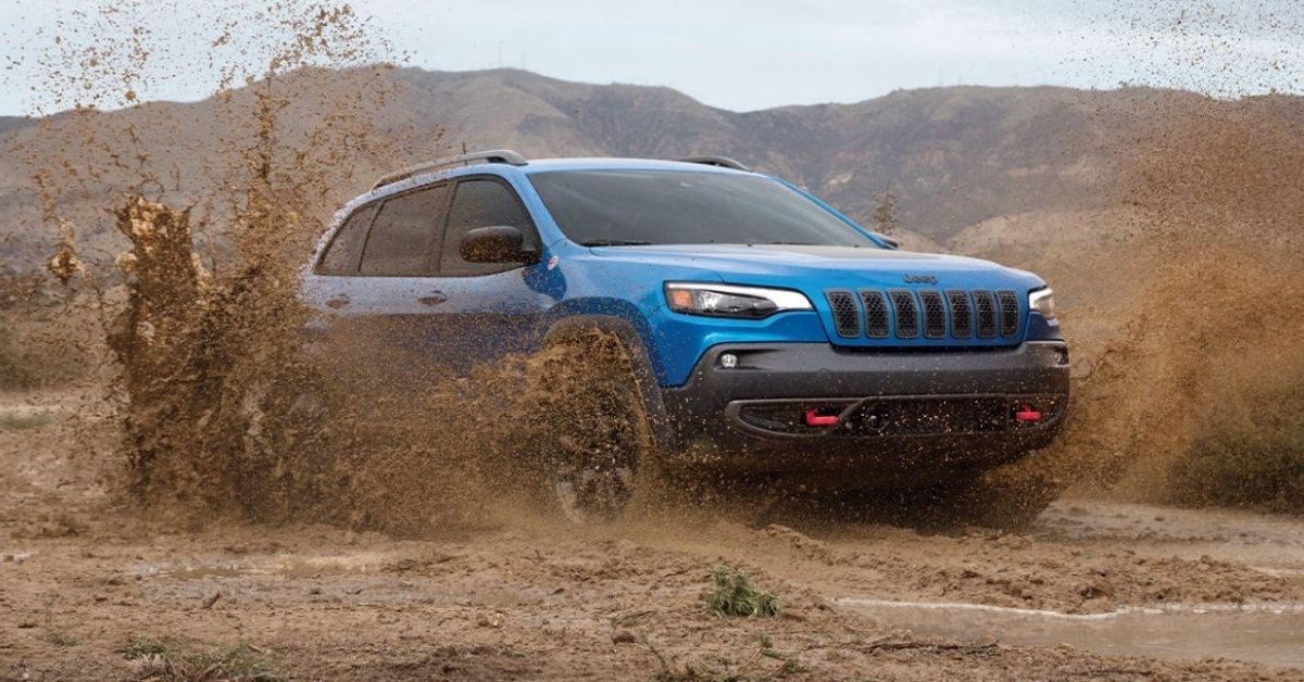 Blue 2021 Jeep Cherokee in the Mud.jpg