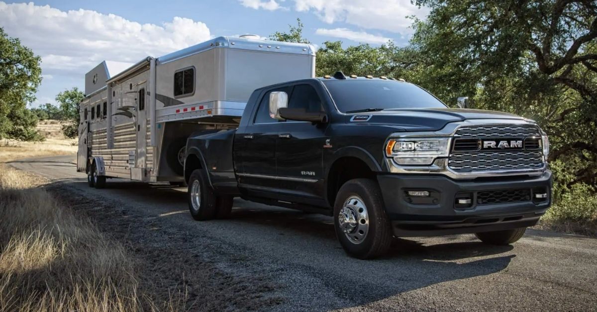 2021 RAM 3500 Pulling A Horse Trailer Down A Dirt Road.jpg