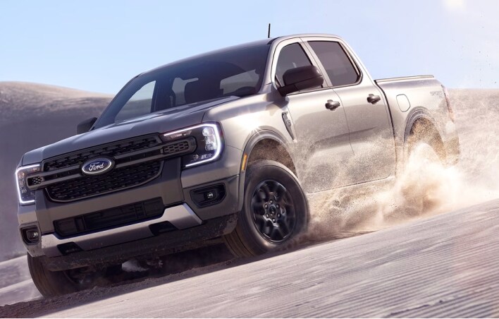 Ford truck driving on sand