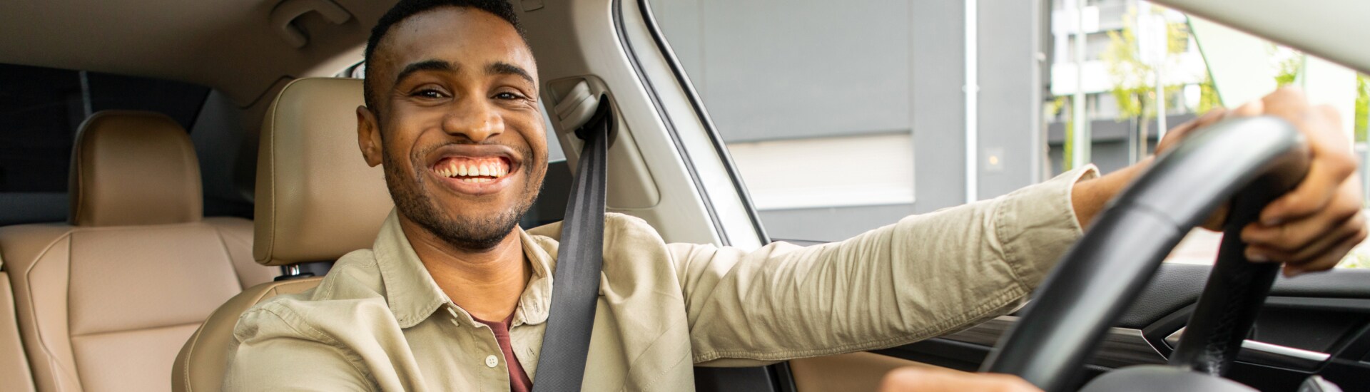 Man happily driving off