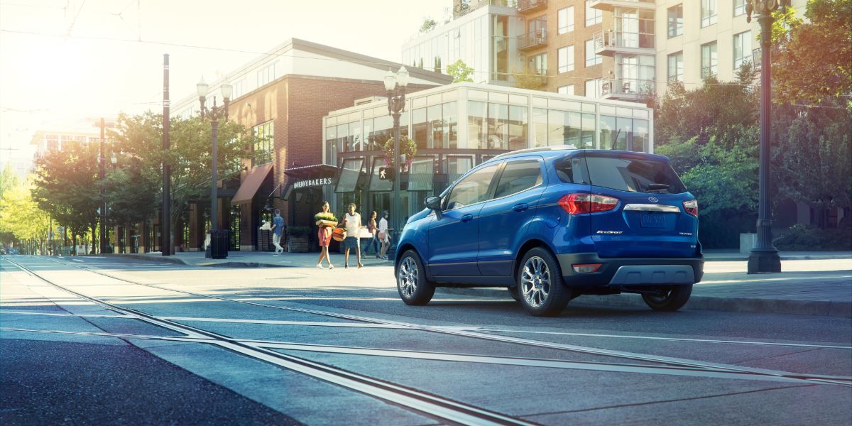 2020 Ford EcoSport blue driving by urban buildings_res.jpg