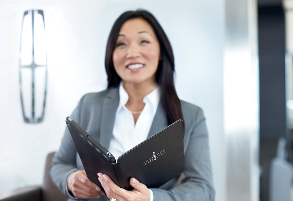 Lincoln service employee answers questions.jpeg