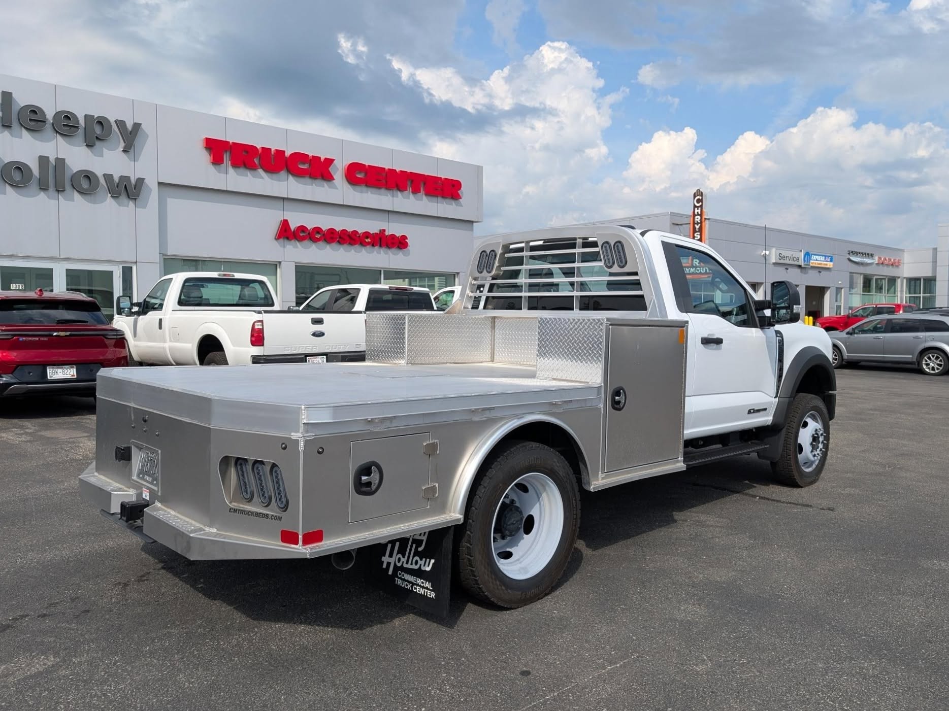 Silver CM skirted flat bed on a truck
