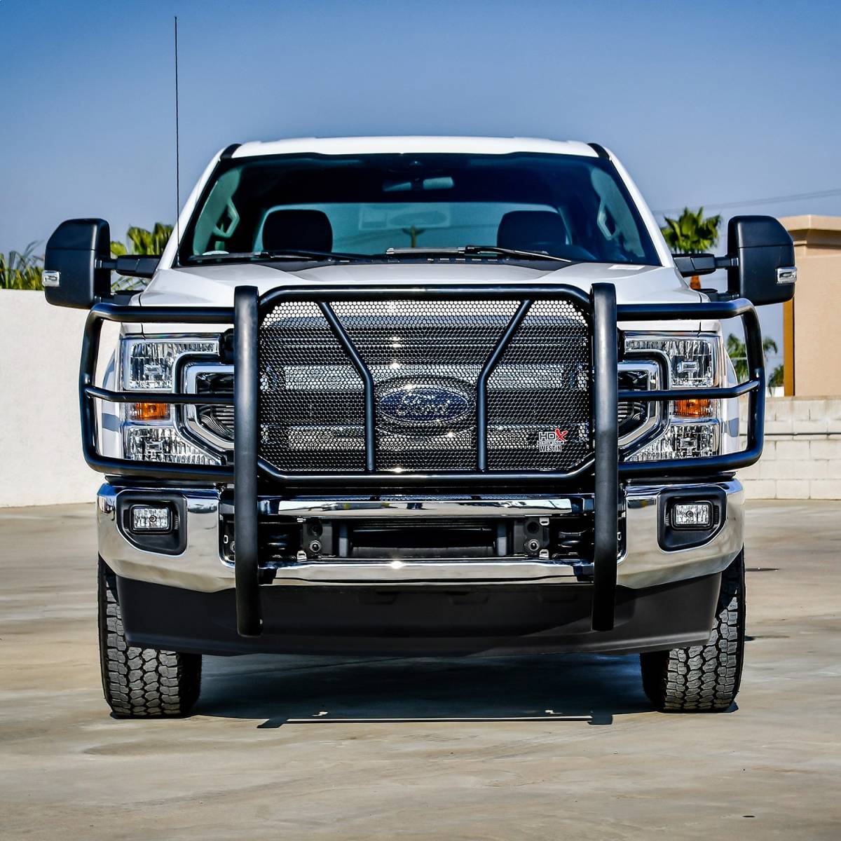 Truck fitted with a heavy-duty brush guard