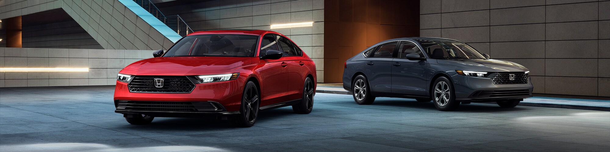 2023-Honda-Accord-Philadelphia-PA.jpg 2023 Honda Accord Radiant Red Sport-L Hybrid Sedan and Meteorite Gray LX Sedan Parked at Night.