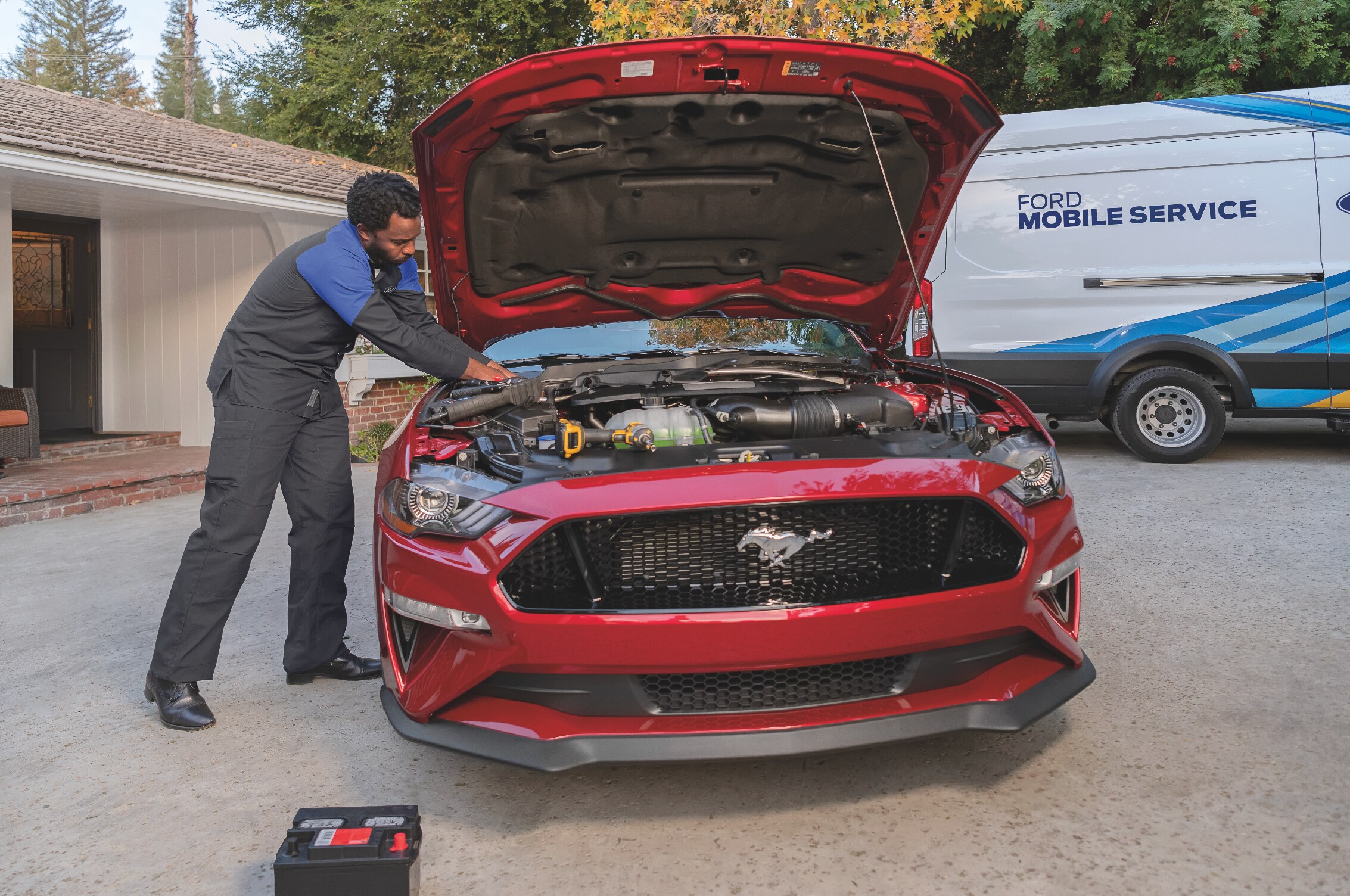 Ford-Technician-Working-In-Driveway