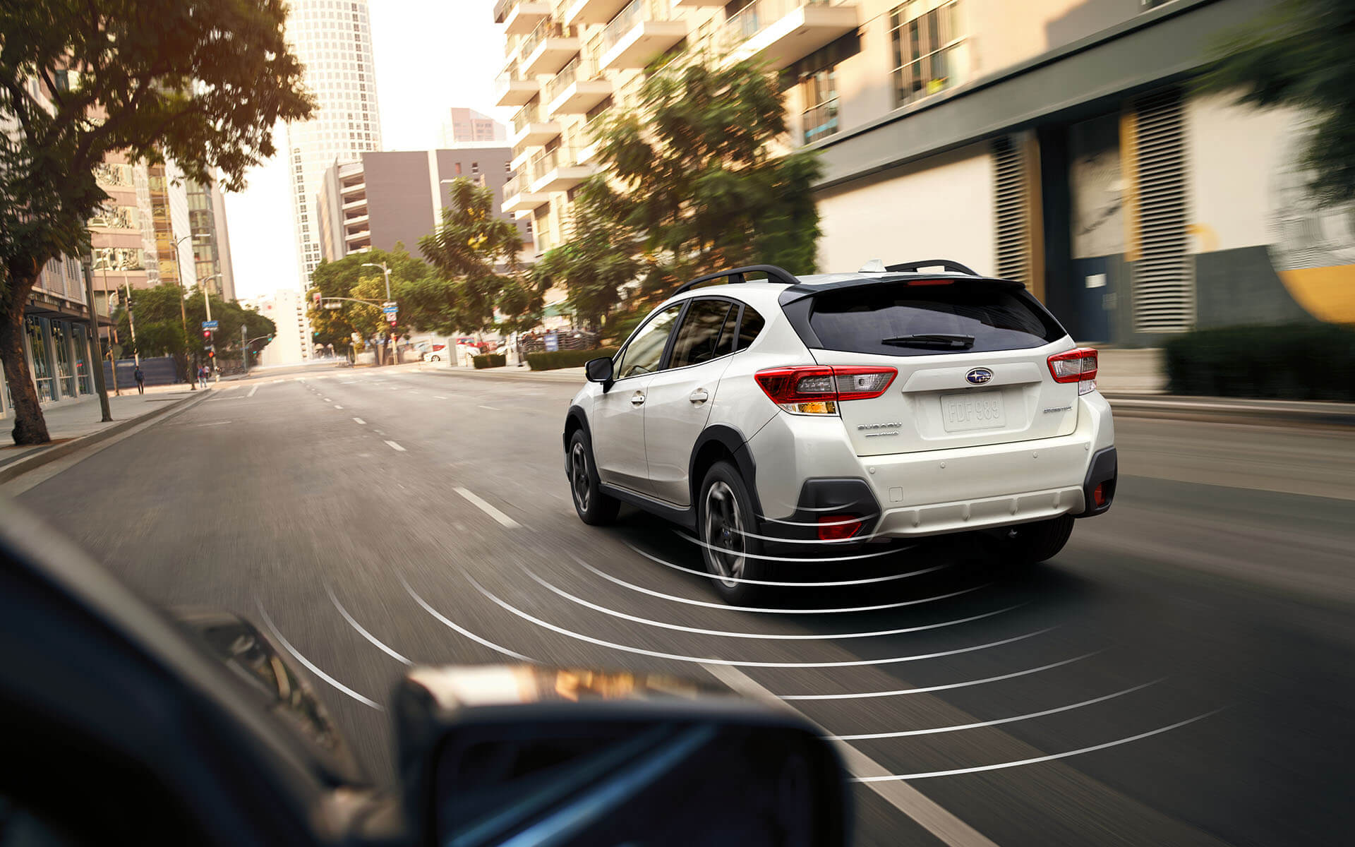 Concentric arcs representing blind spot detection coming from rear corner of Crosstrek
