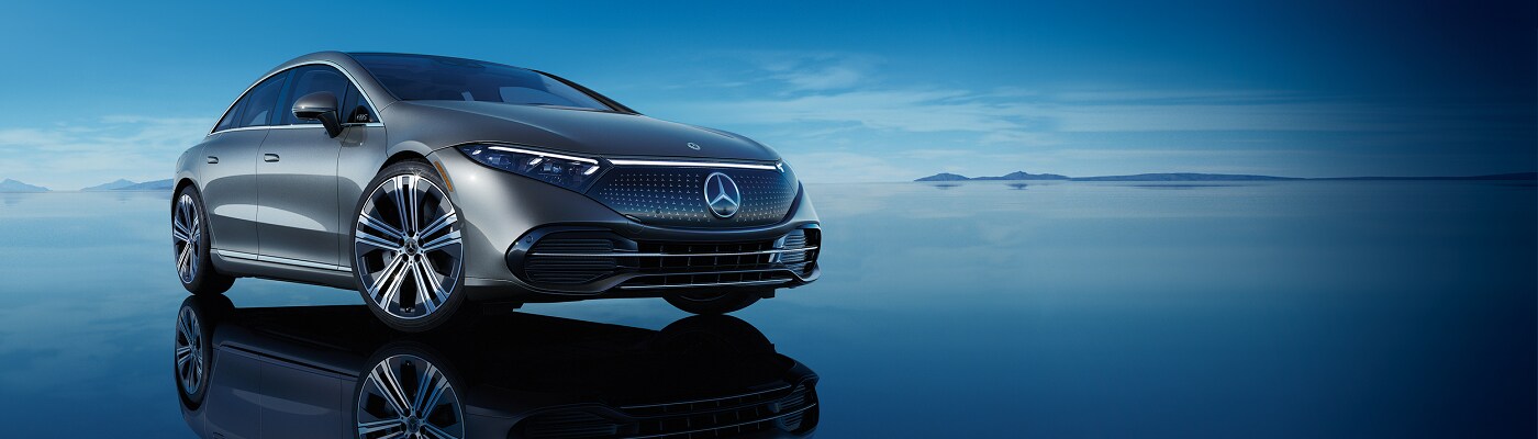 2023 EQS Sedan Grey 2023 EQS parked on a reflective pool of water
