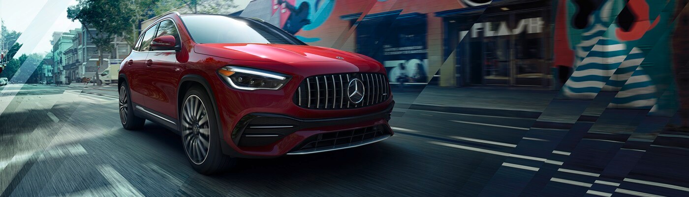 Mercedes-Benz AMG GLA 35 Red Mercedes-Benz AMG GLA 35 driving on a city street