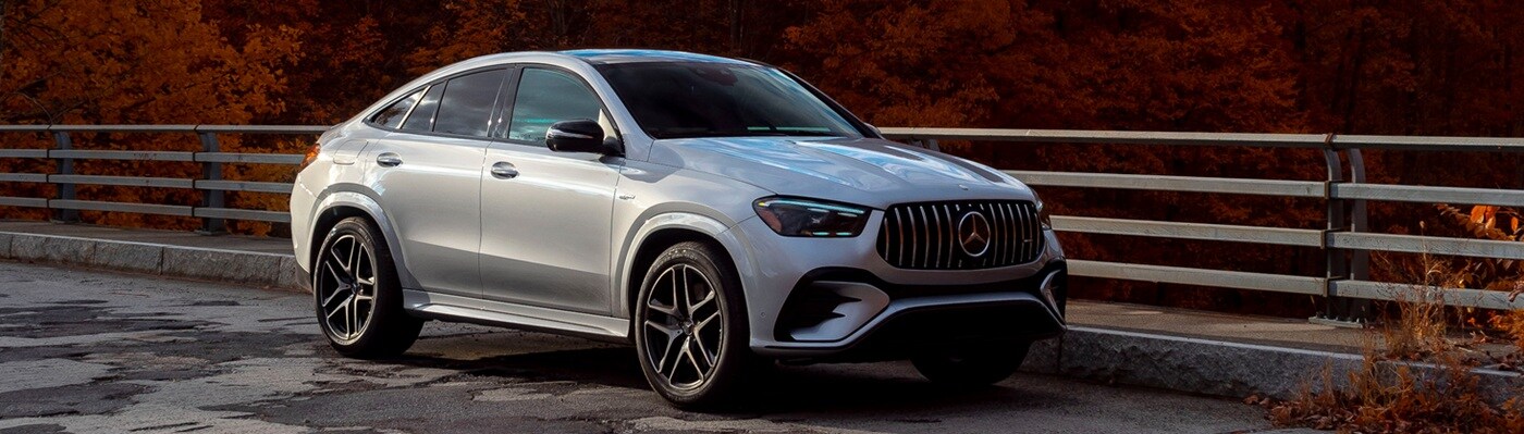Mercedes-Benz AMG GLE Silver Mercedes-Benz AMG GLE Coupe parked on a bridge in the fall