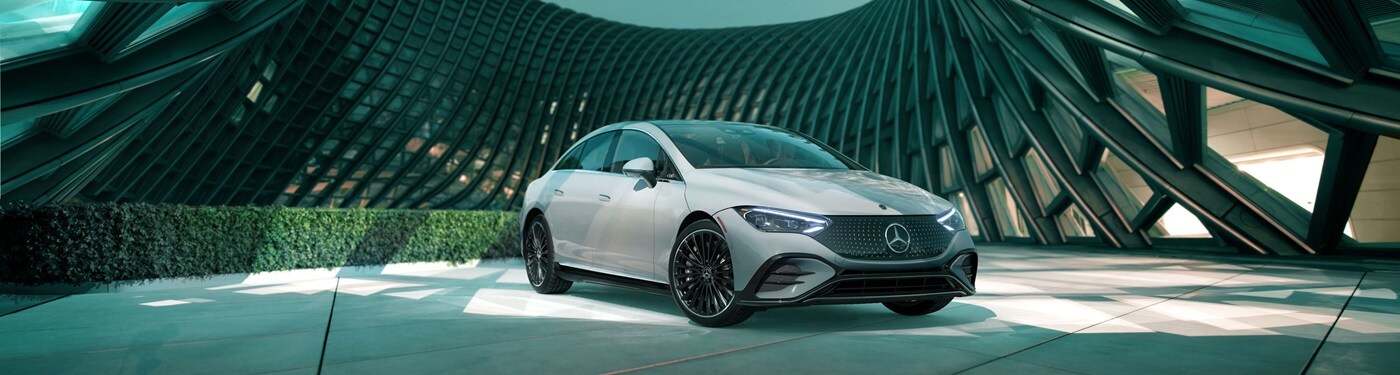 Mercedes-Benz EQE Grey Mercedes-Benz EQE Sedan parked in a modern space