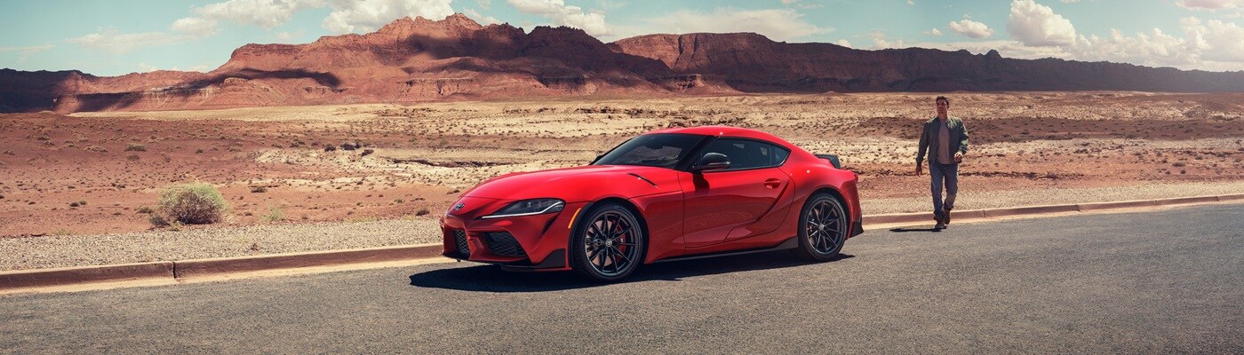Toyota GR Supra Red Toyota GR Supra parked in the desert