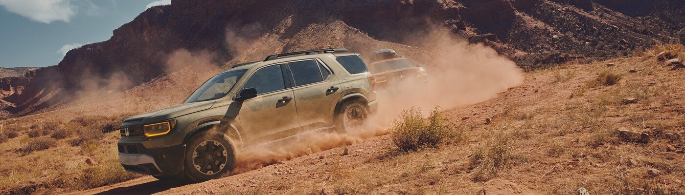 Honda Passport TrailSport Elite Two Passport TrailSport Elite models driving in the desert