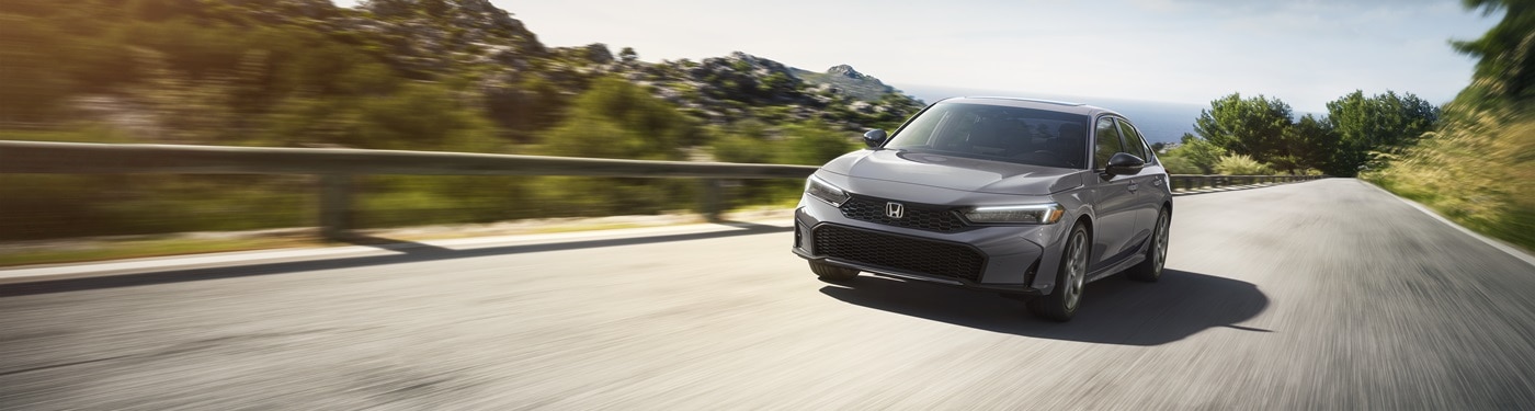 Honda Civic Sport Touring Hybrid Grey Civic Sport Touring Hybrid on a sunny road