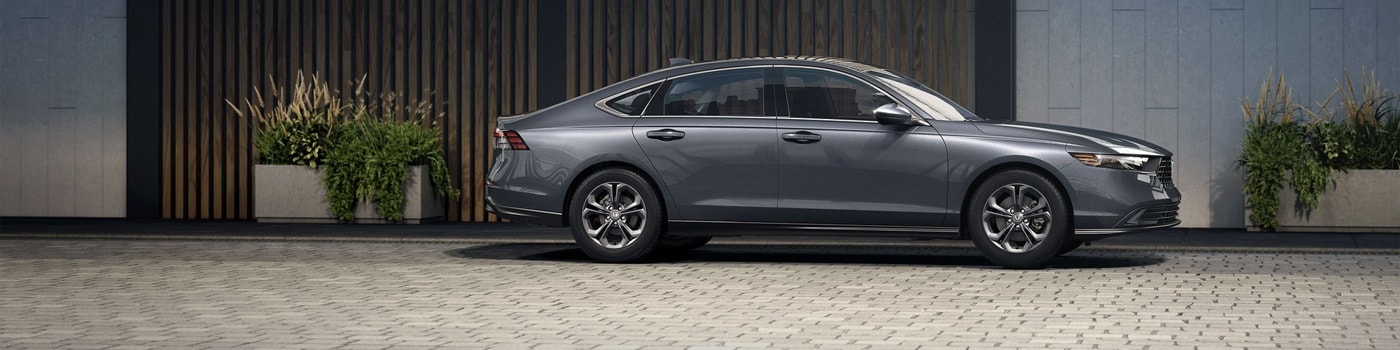 Honda Accord Grey Honda Accord SE parked by a modern home