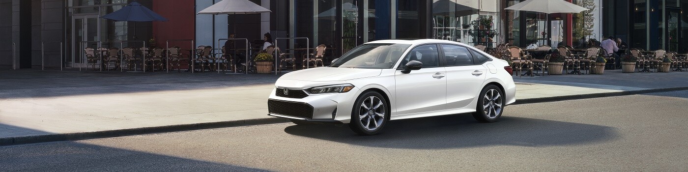 Honda Civic Sport Touring Hybrid Red Honda Civic Sport Touring Hybrid driving in San Francisco