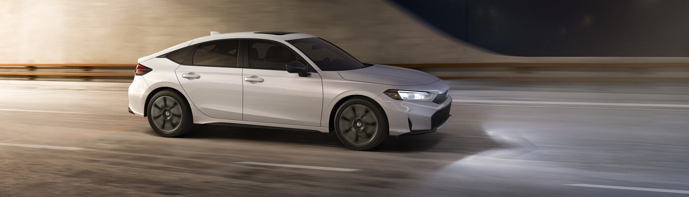 Honda Civic Hatchback Civic Hatchback Sport Touring Hybrid driving in a city