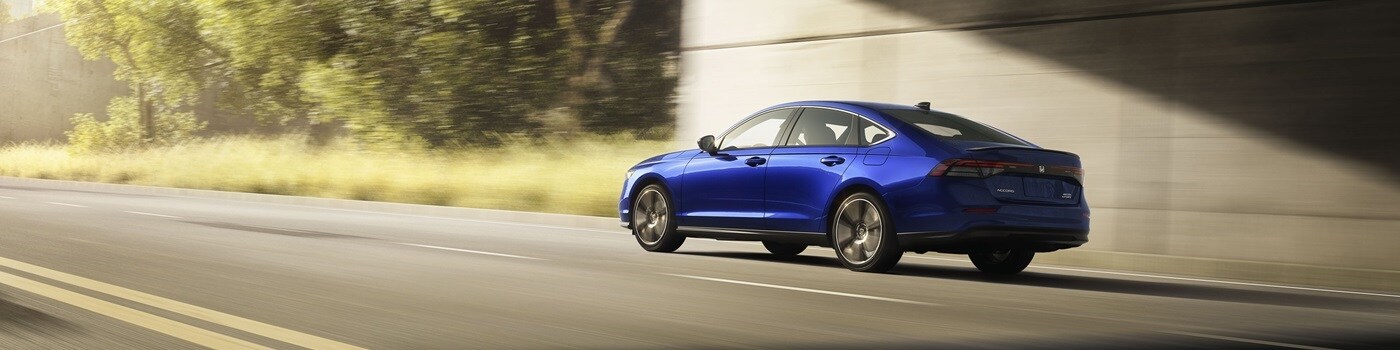 Honda Accord Hybrid Sport Blue Honda Accord Hybrid Sport driving on the highway
