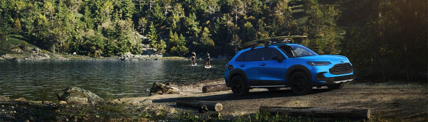 Honda HR-V Blue HR-V Sport parked by a lake