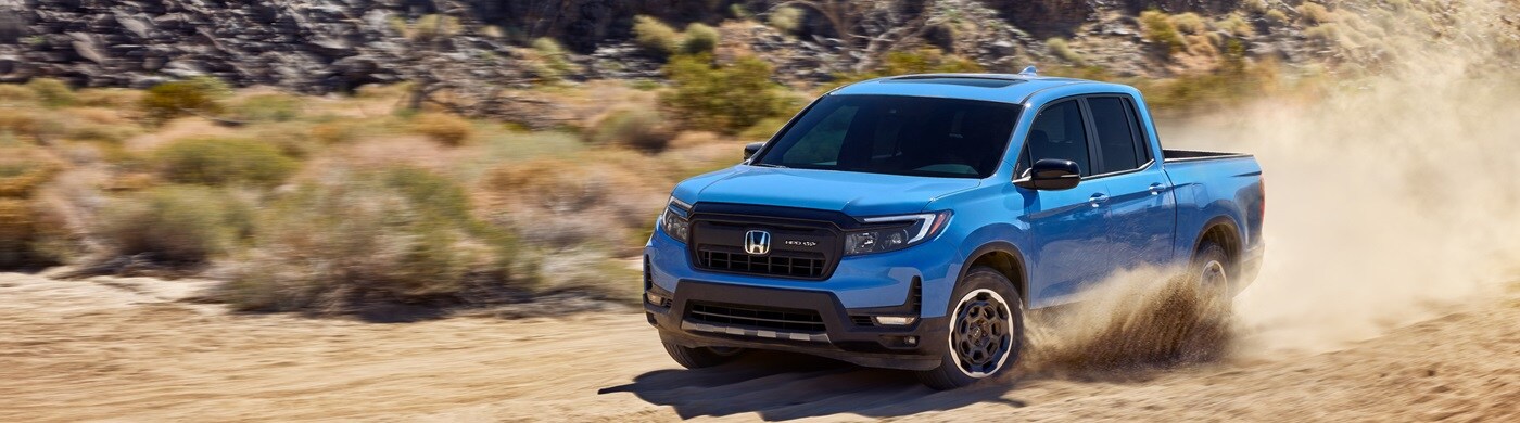 Honda Ridgeline Blue Honda Ridgeline TrailSport driving in the desert