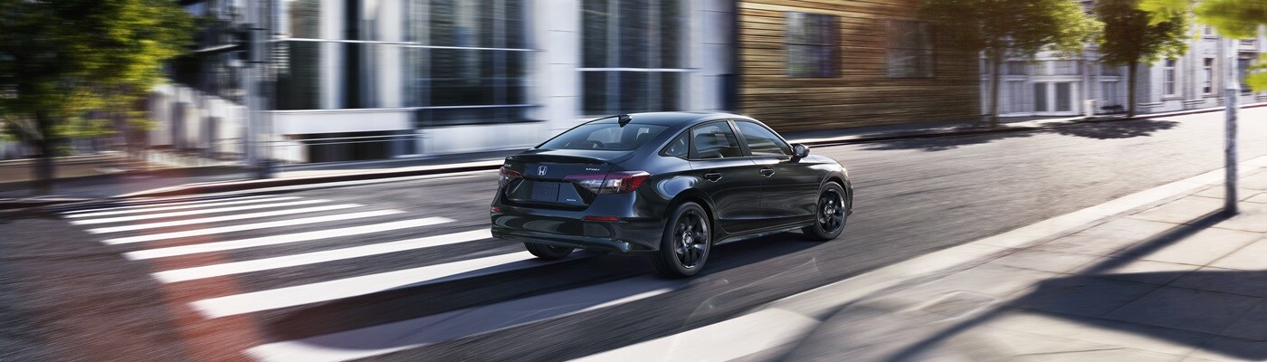 Honda Civic Sport Touring Hybrid Black Honda Civic Sport Touring Hybrid driving away