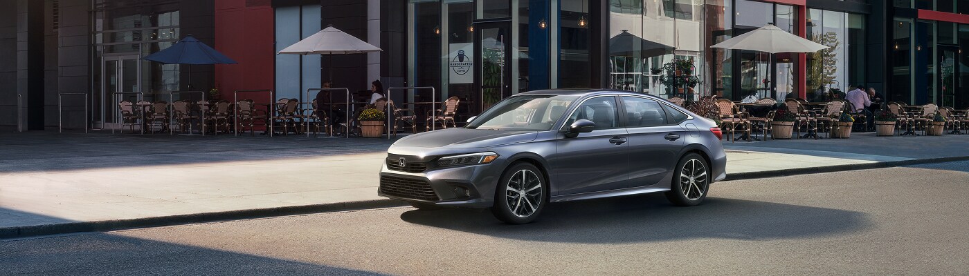 Honda Civic Grey Civic Touring parked in a city