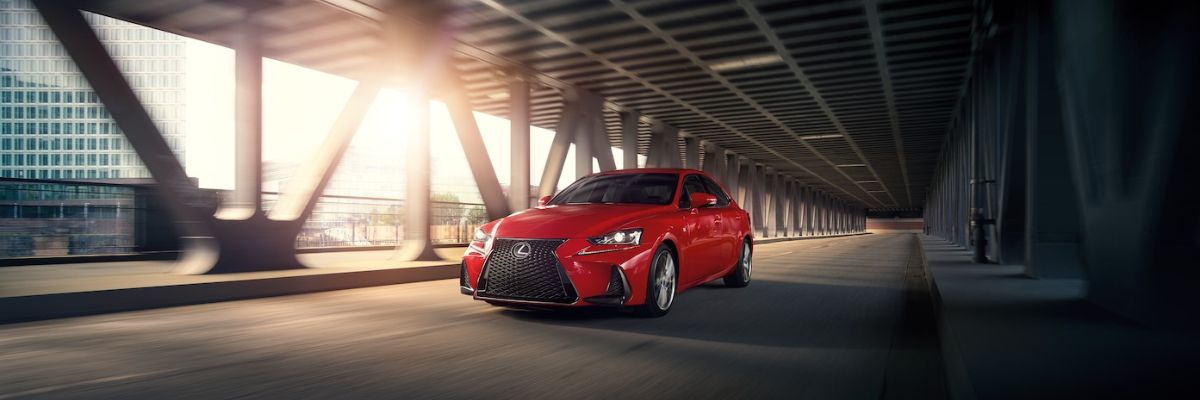 Lexus IS driving on a bridge
